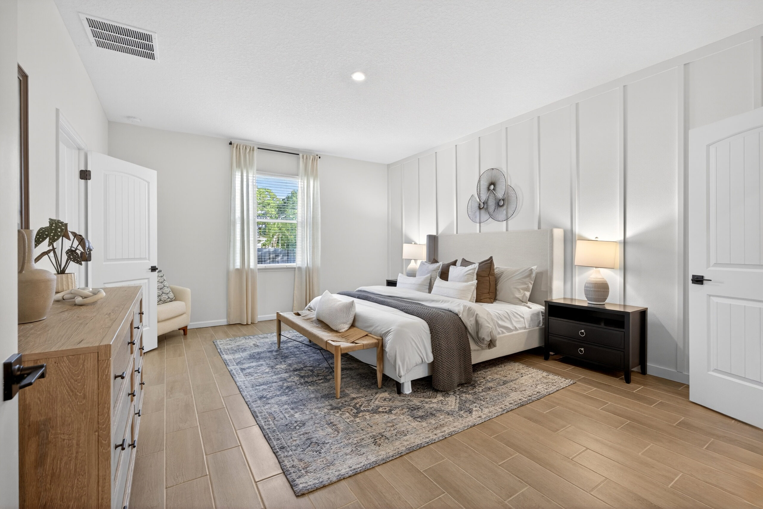Bright bedroom with large window in a new construction home at Tumbleson in St. Cloud, FL